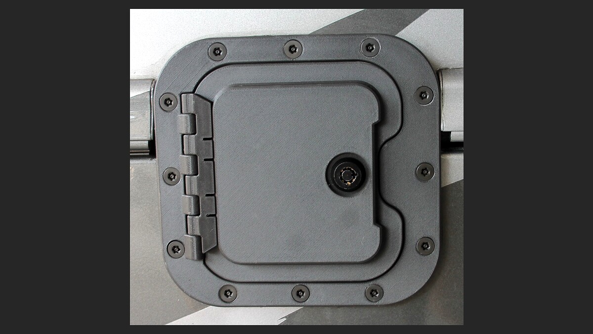 After: The RV Fuel Vault armored locking fuel door installed — tamper-resistant, factory-finished look that covers the exposed diesel fuel cap